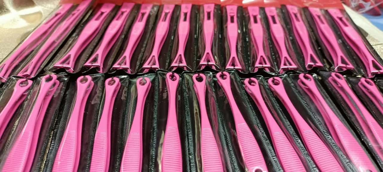 Pink piercing forceps