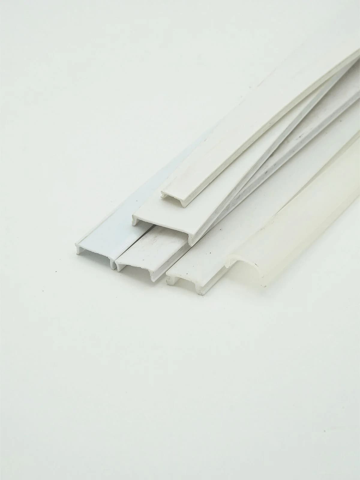 assorted white plastic profiles