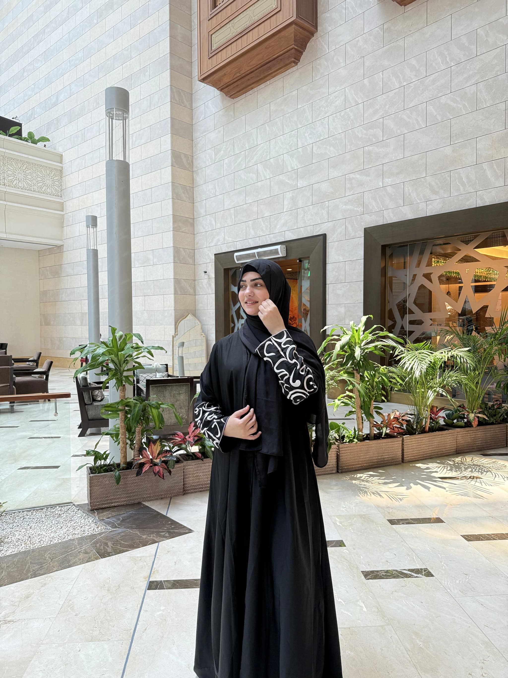Black abaya with white embroidered cuffs