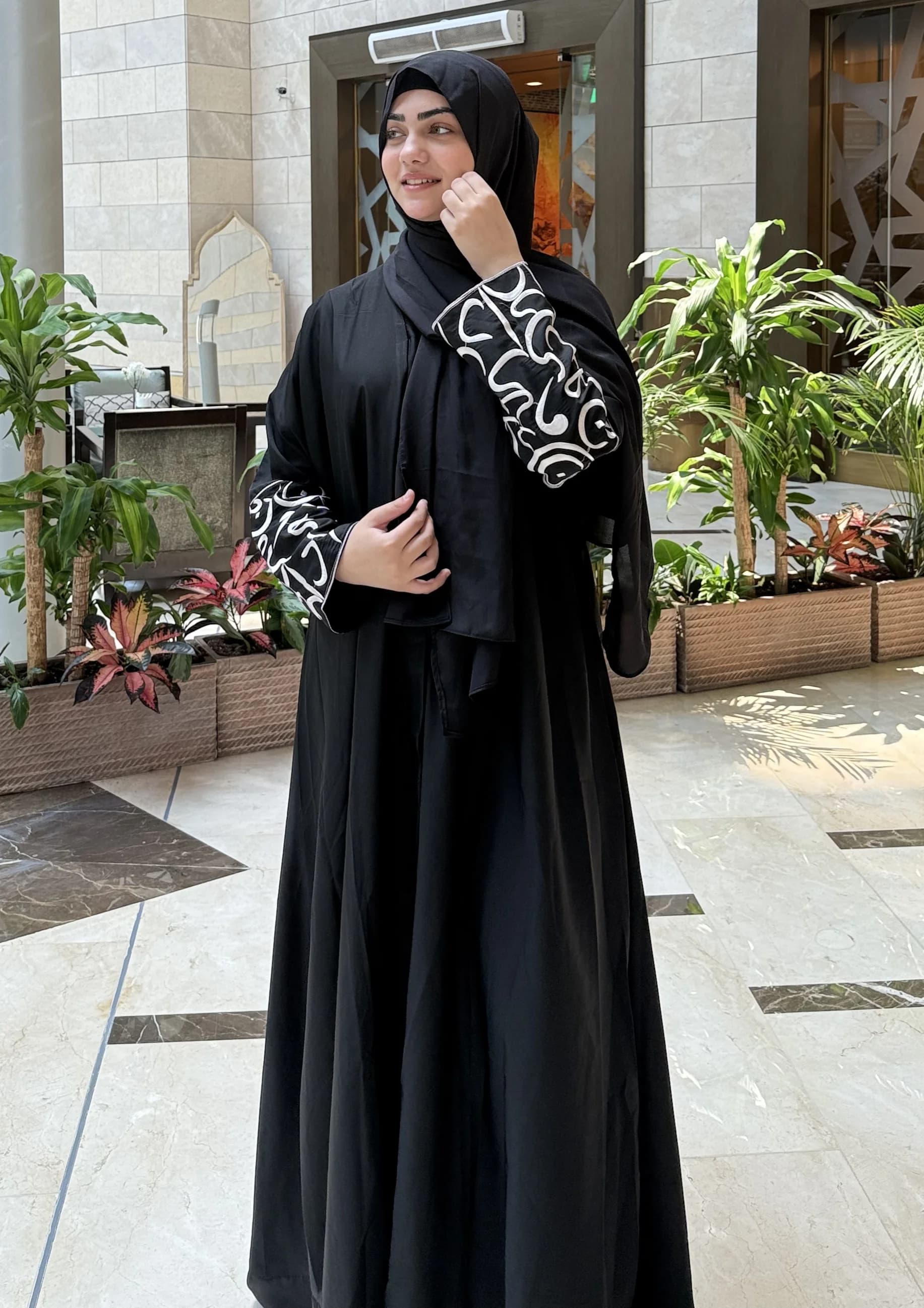 Black abaya with white embroidered cuffs