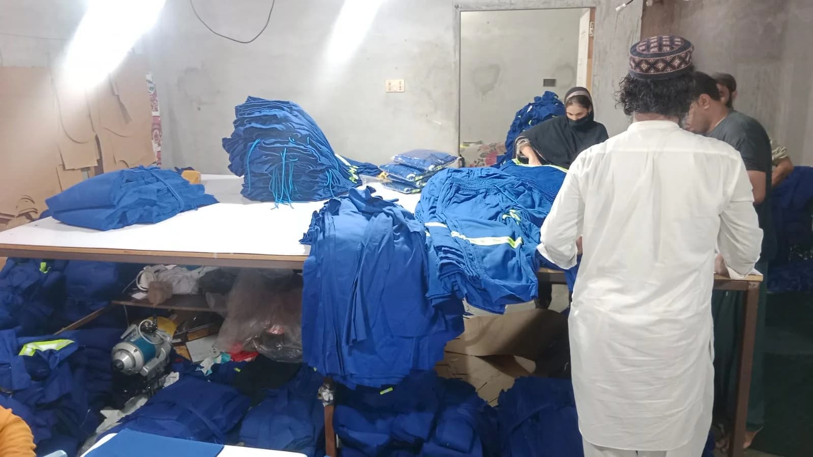 Blue reflective uniforms in production