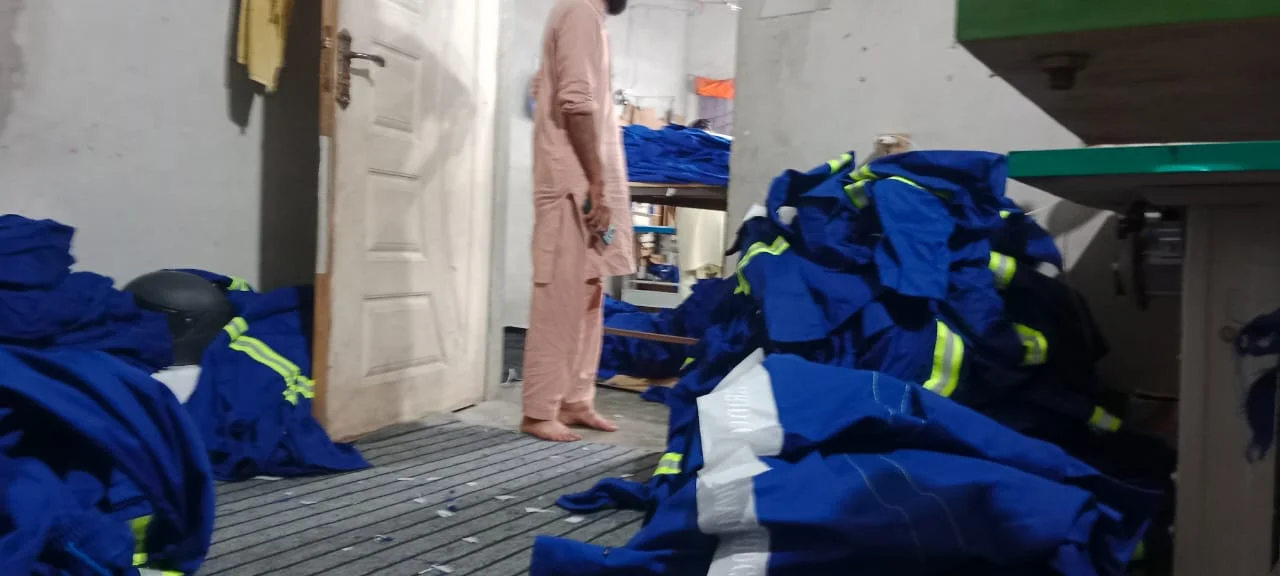 Blue reflective uniforms in production