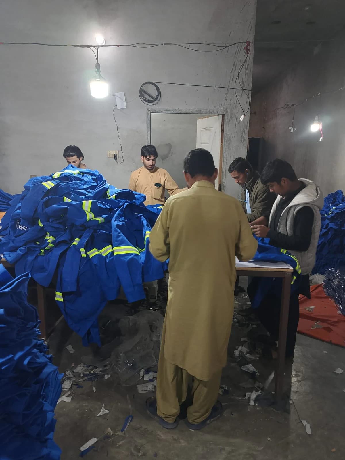 Blue reflective uniforms in production