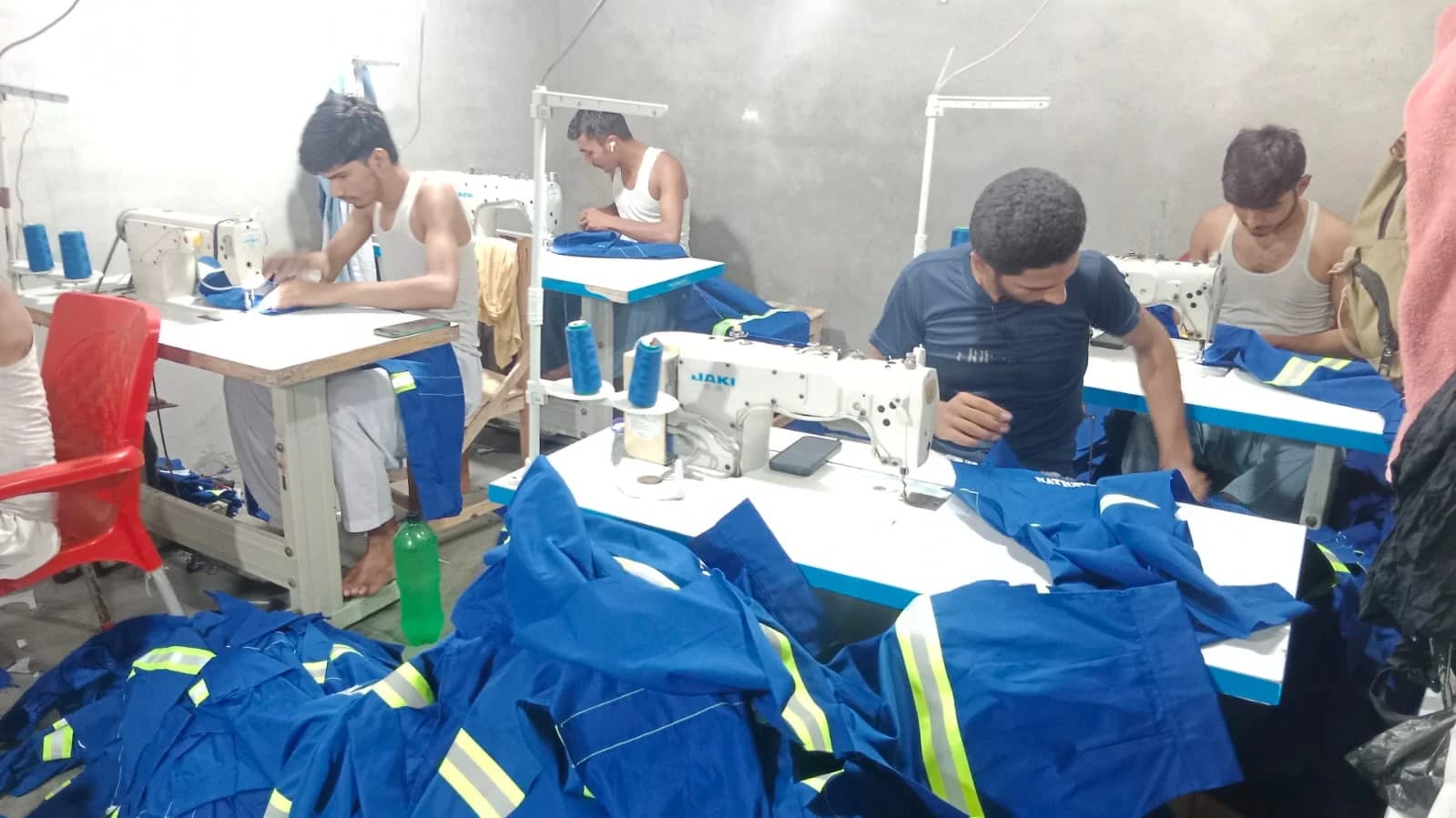Blue reflective uniforms in sewing