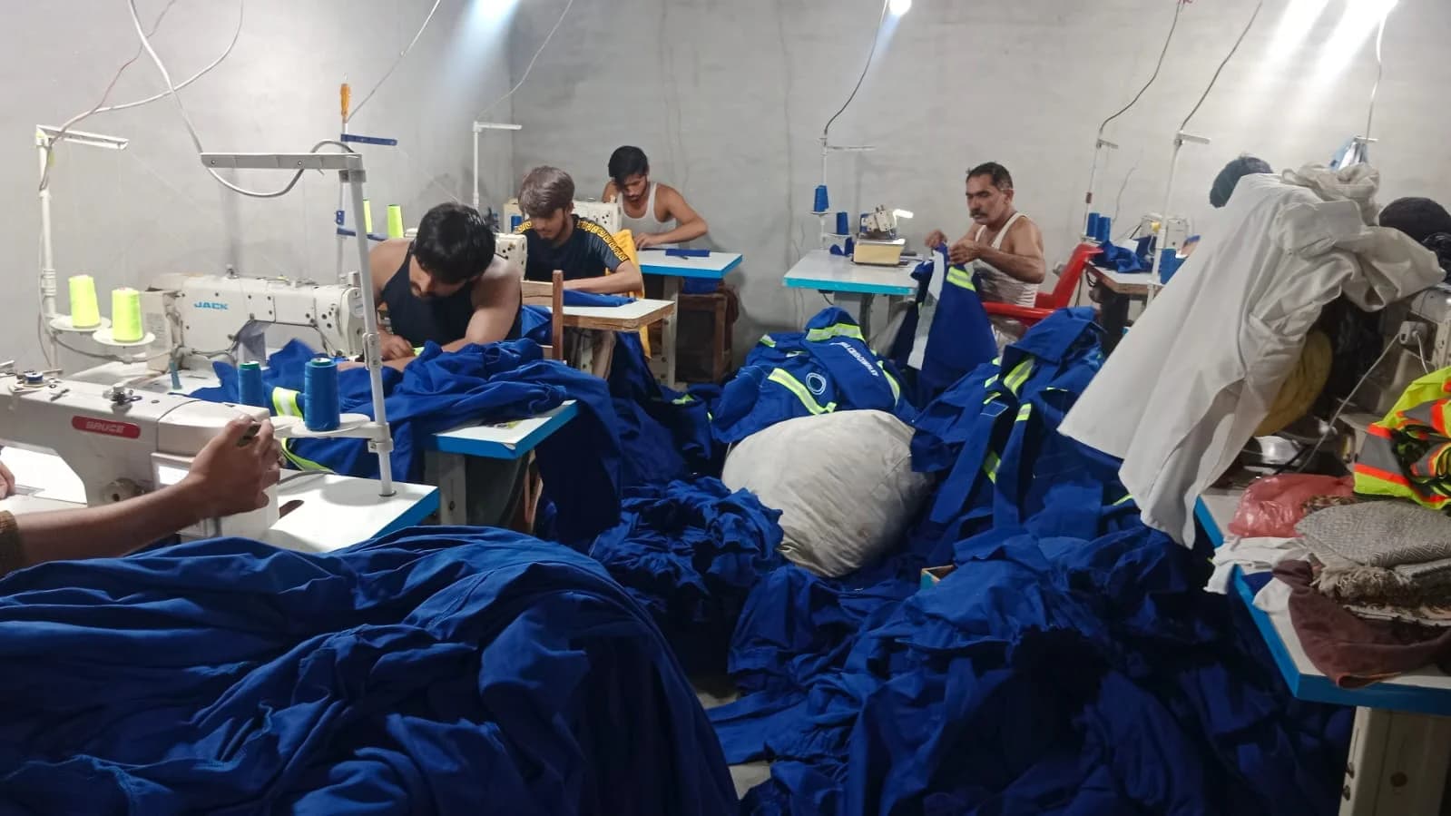 Blue reflective uniforms in sewing