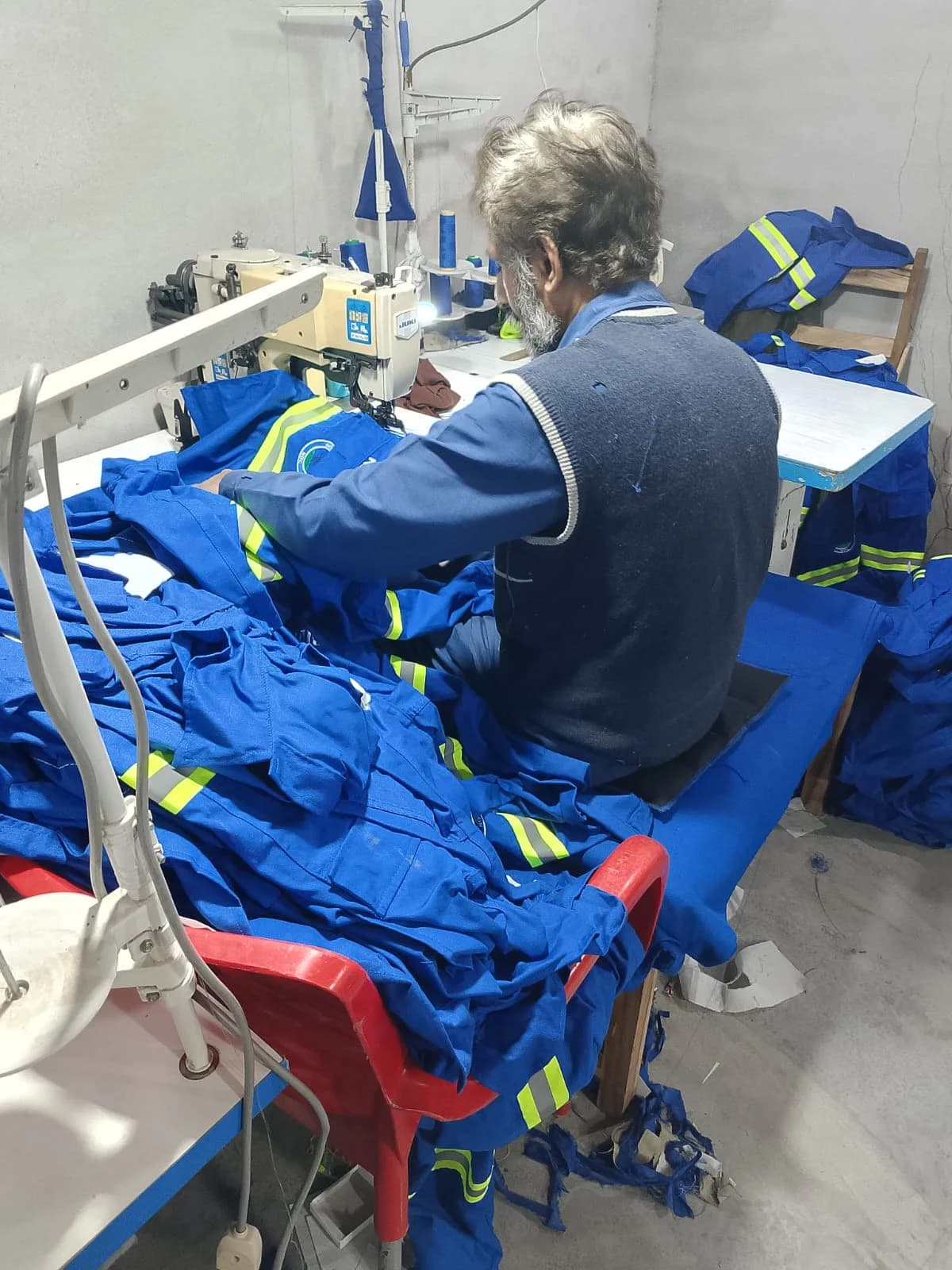 Blue reflective uniforms in sewing