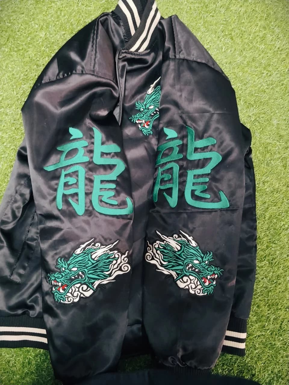 Bomber jacket with sleeve dragon graphics