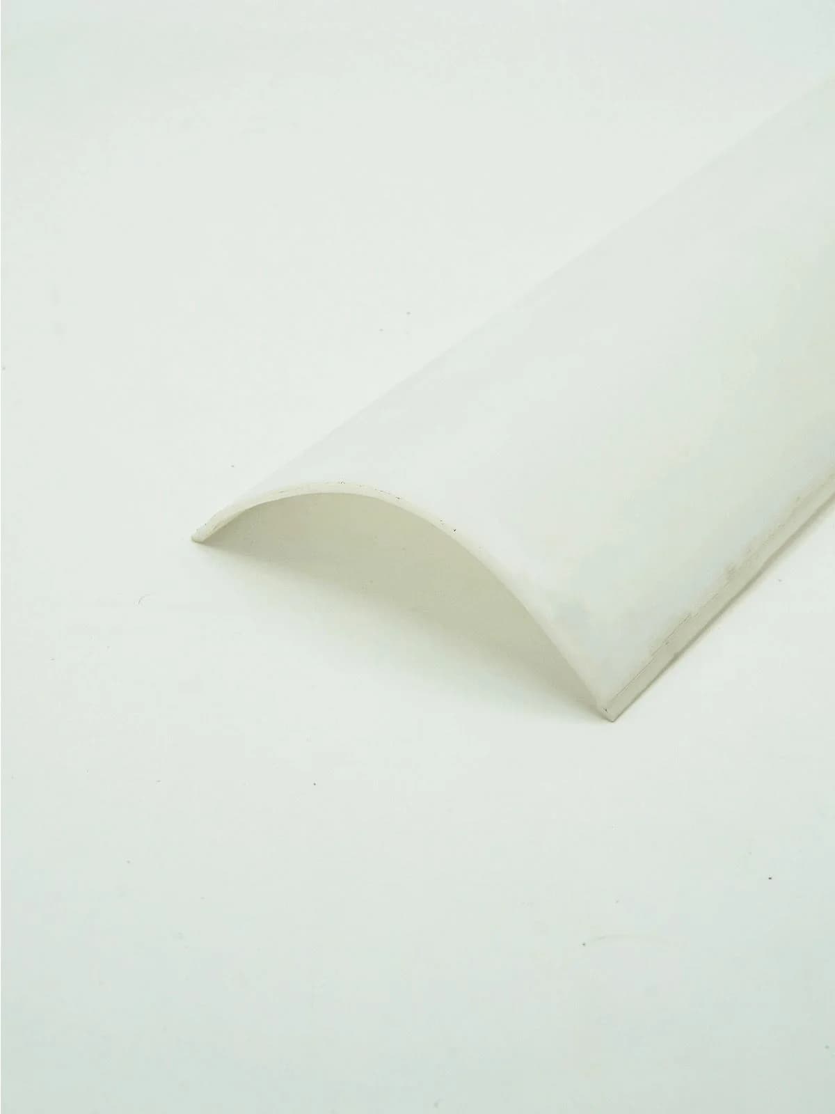 curved white plastic profile