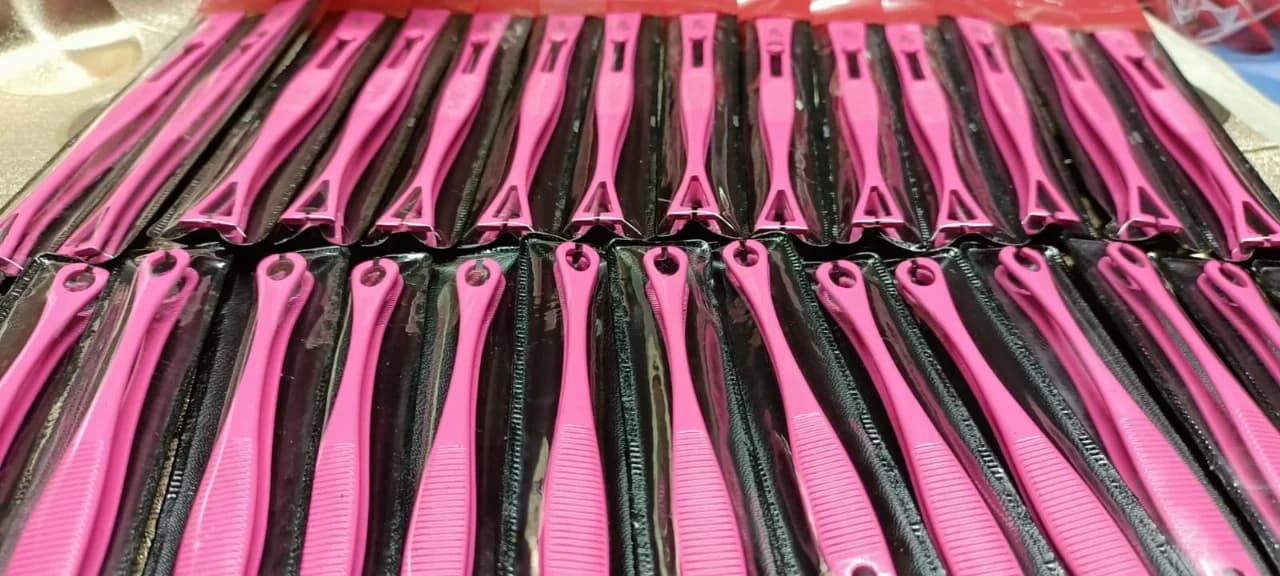 Pink piercing forceps