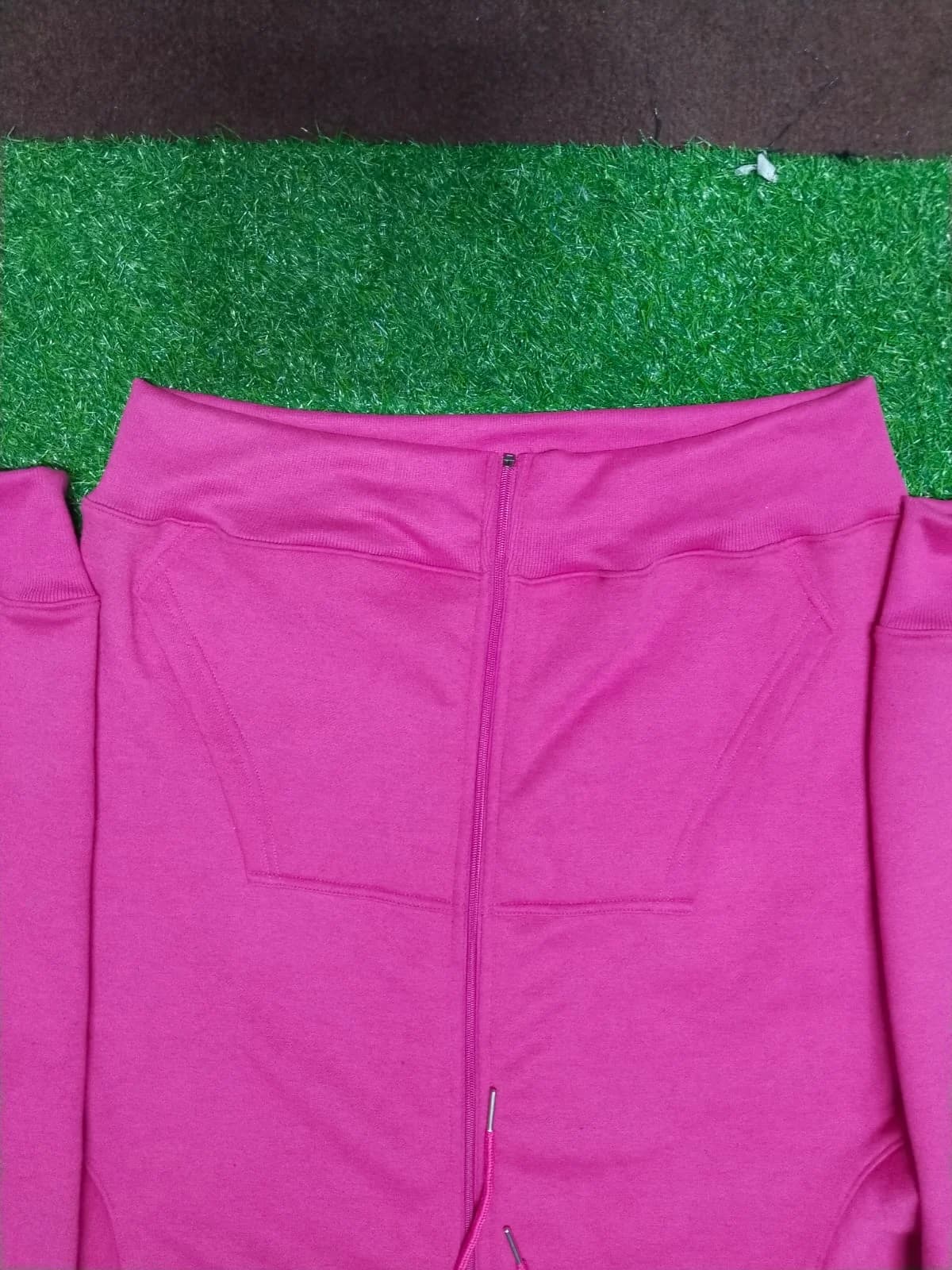 Pink zip-up hoodie front detail
