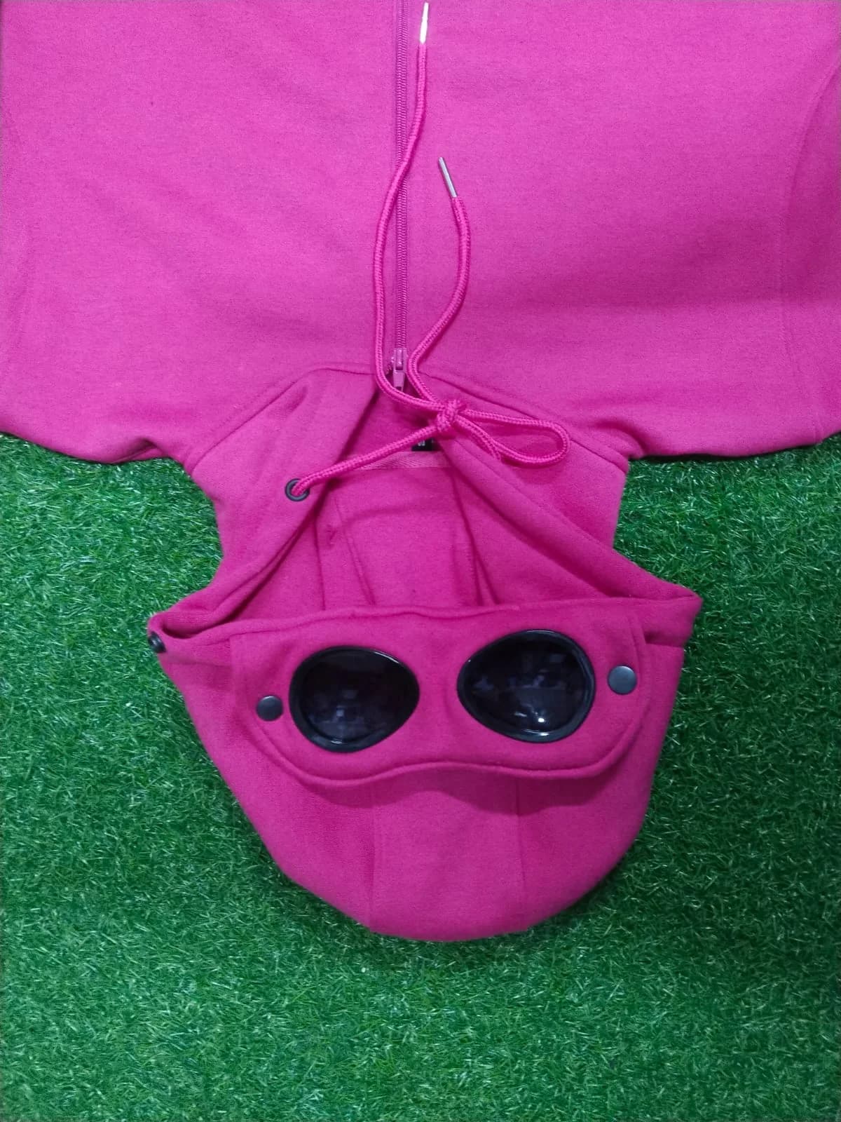 Pink zip-up hoodie with goggle hood