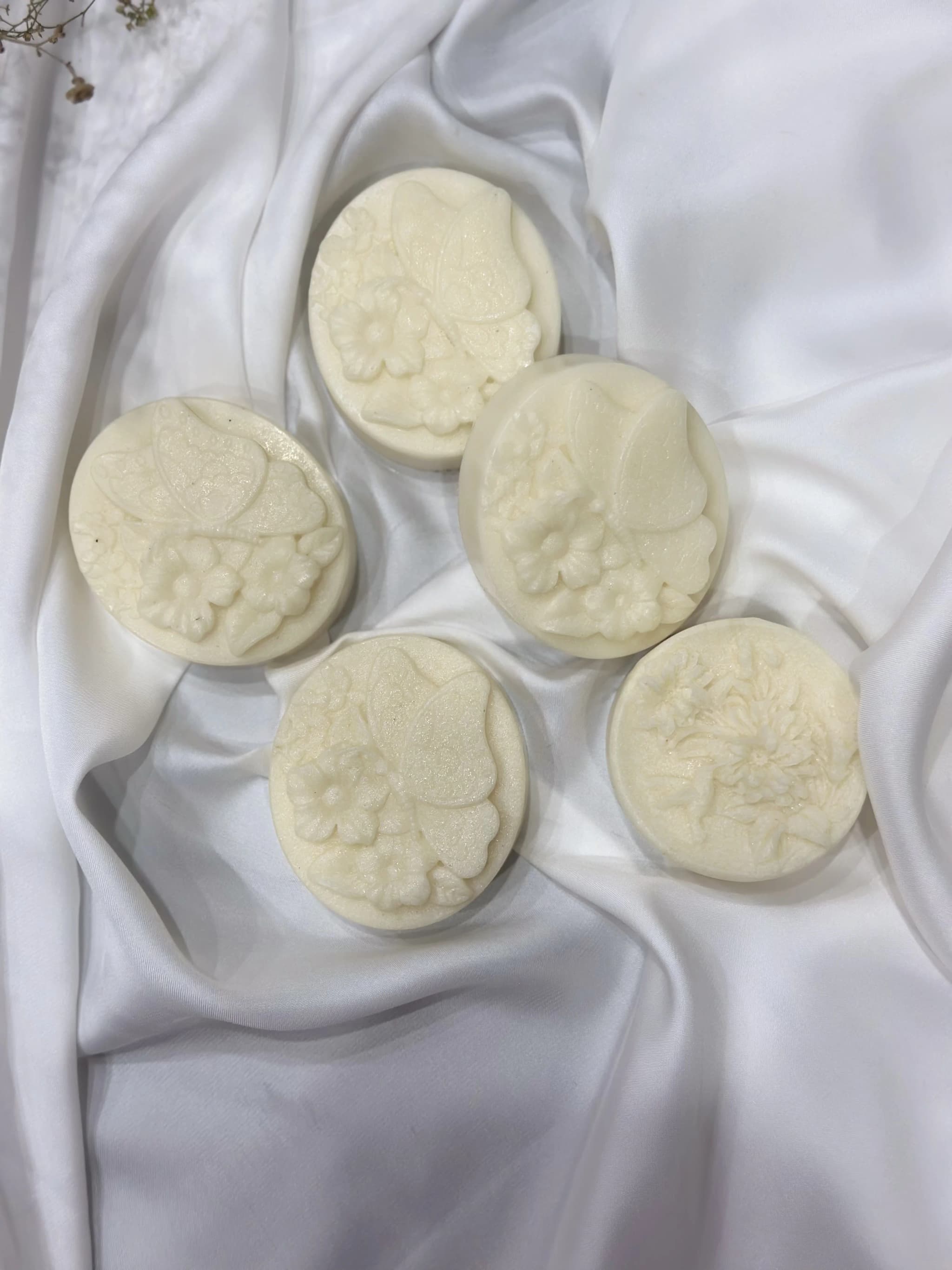 white soap with butterfly and flower design