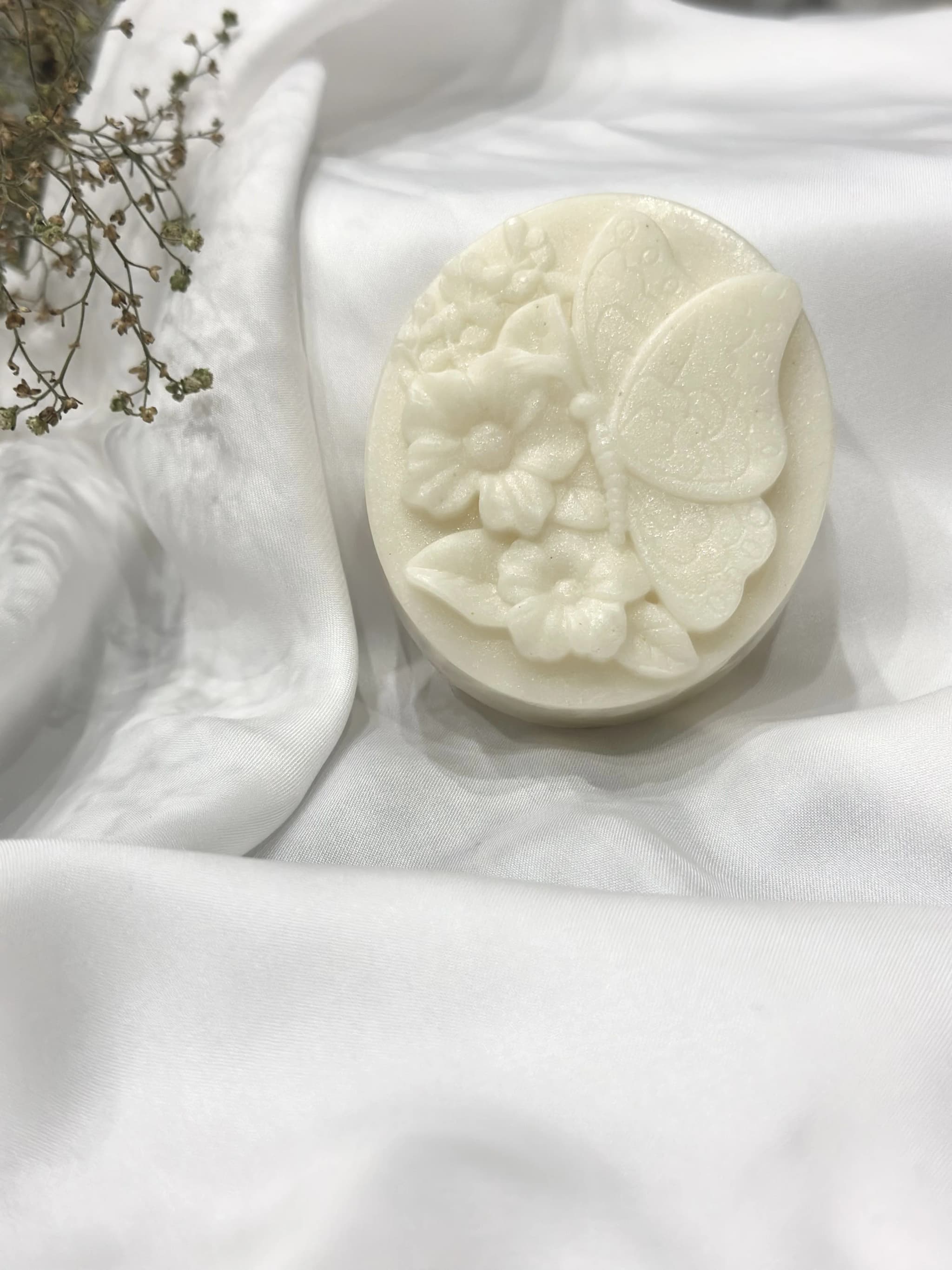 white soap with butterfly and flower design