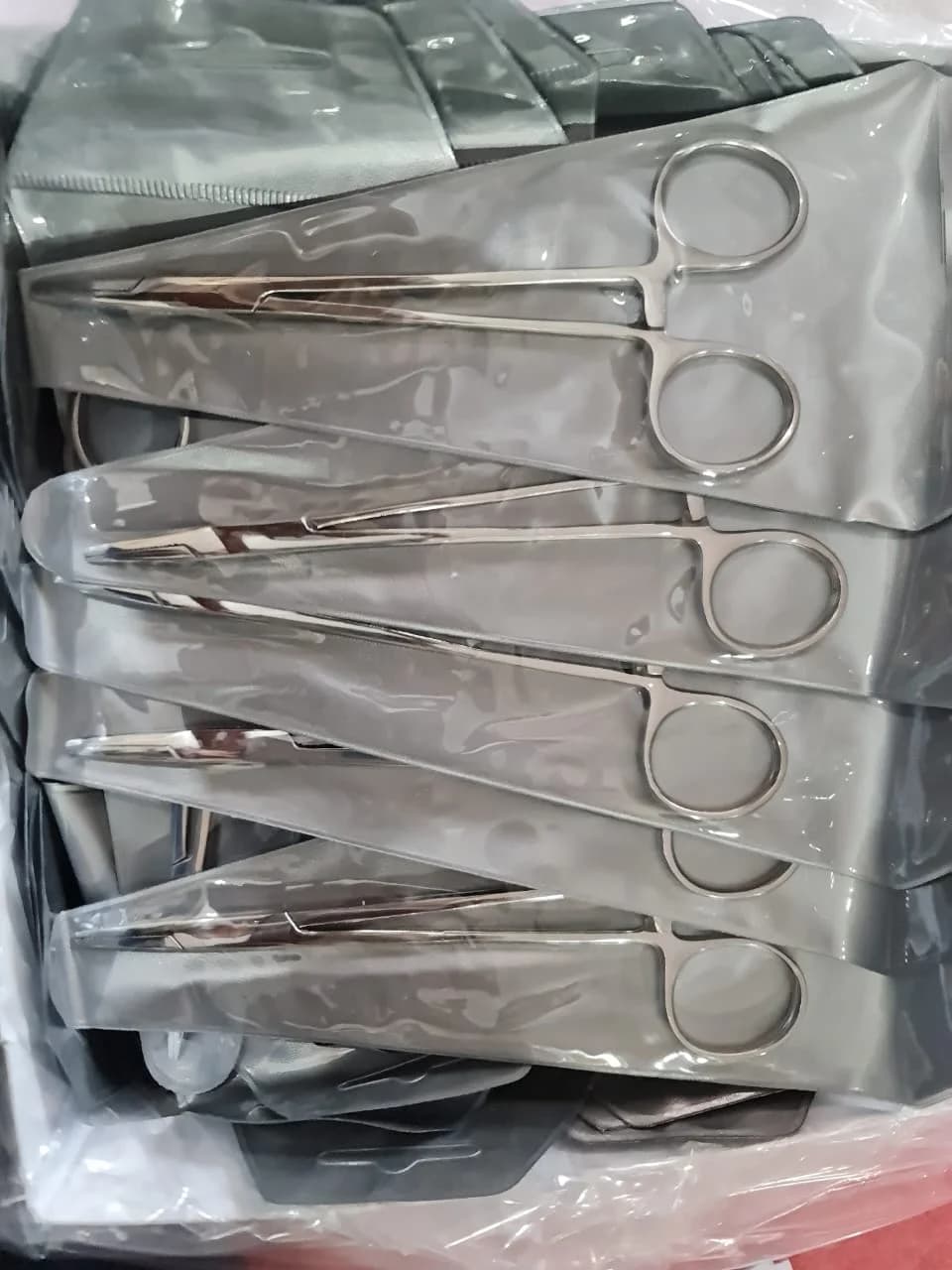 Ring-handle piercing forceps