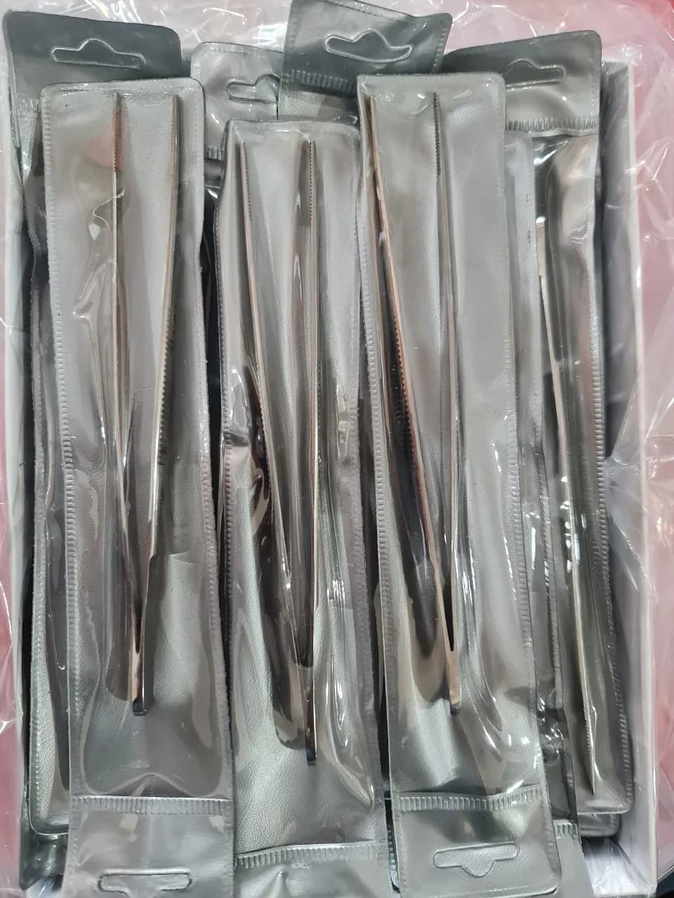 Slotted piercing tweezers
