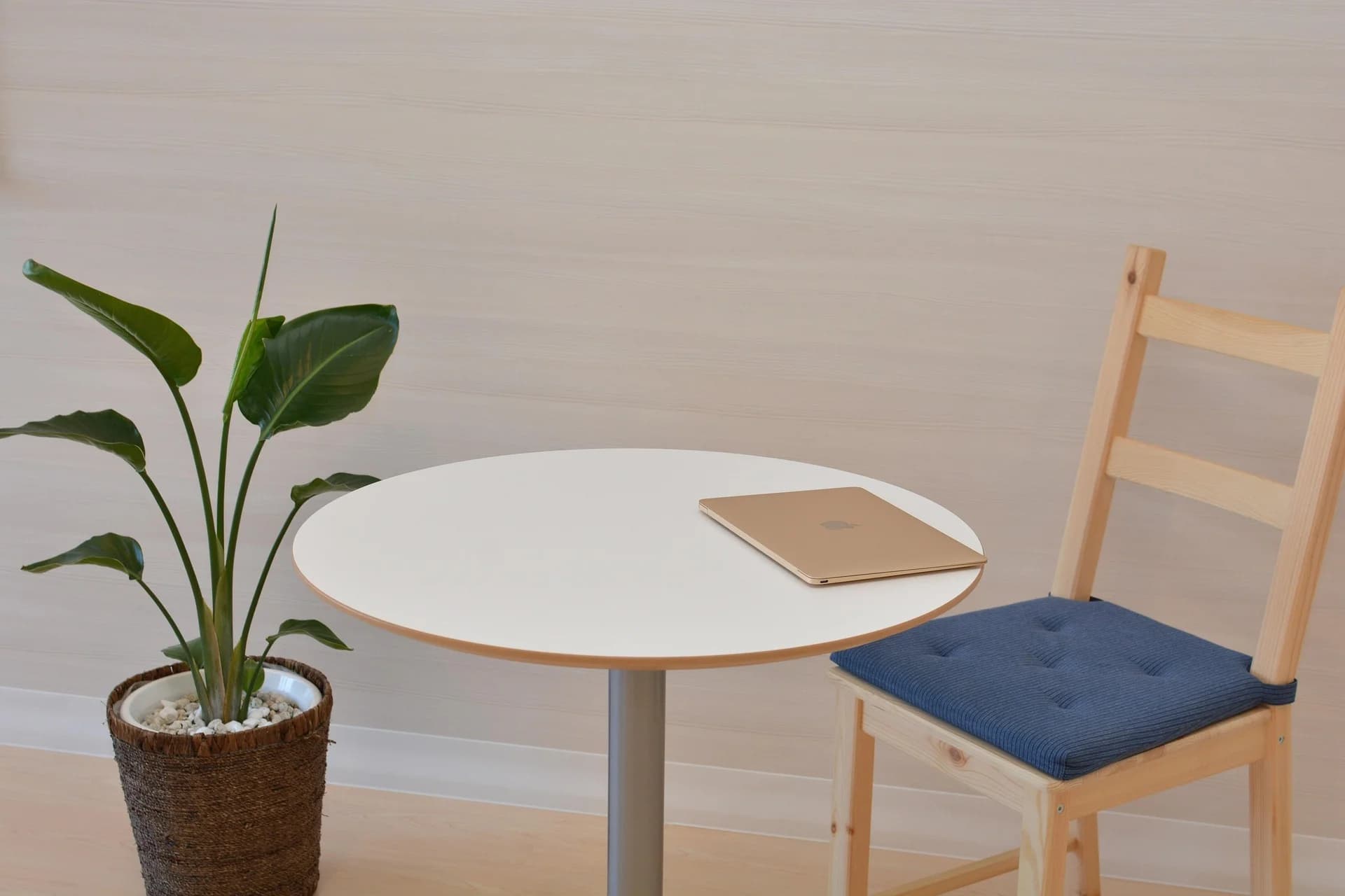 wooden chair with blue cushion