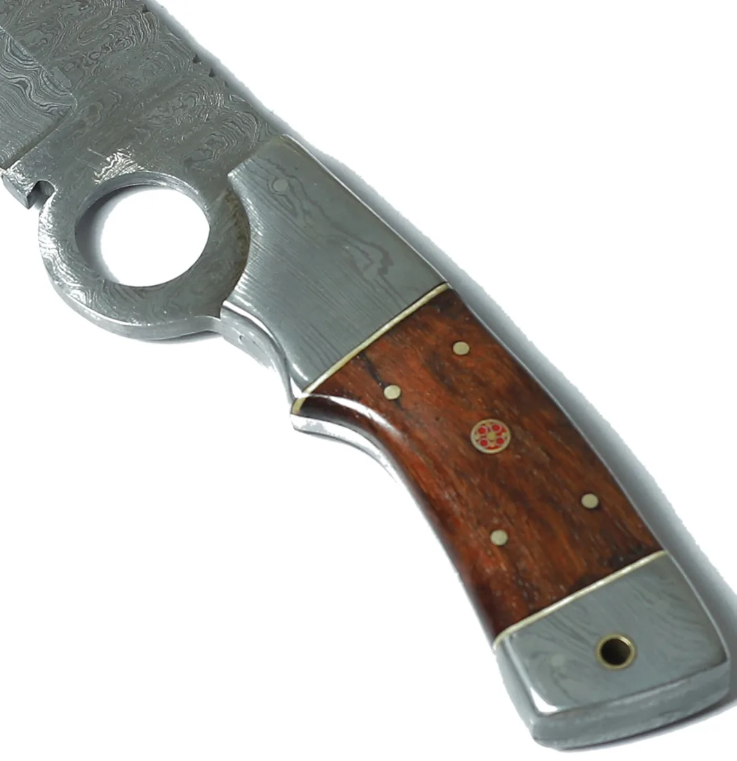 Rosewood knife handle with brass pins and inlay medallion