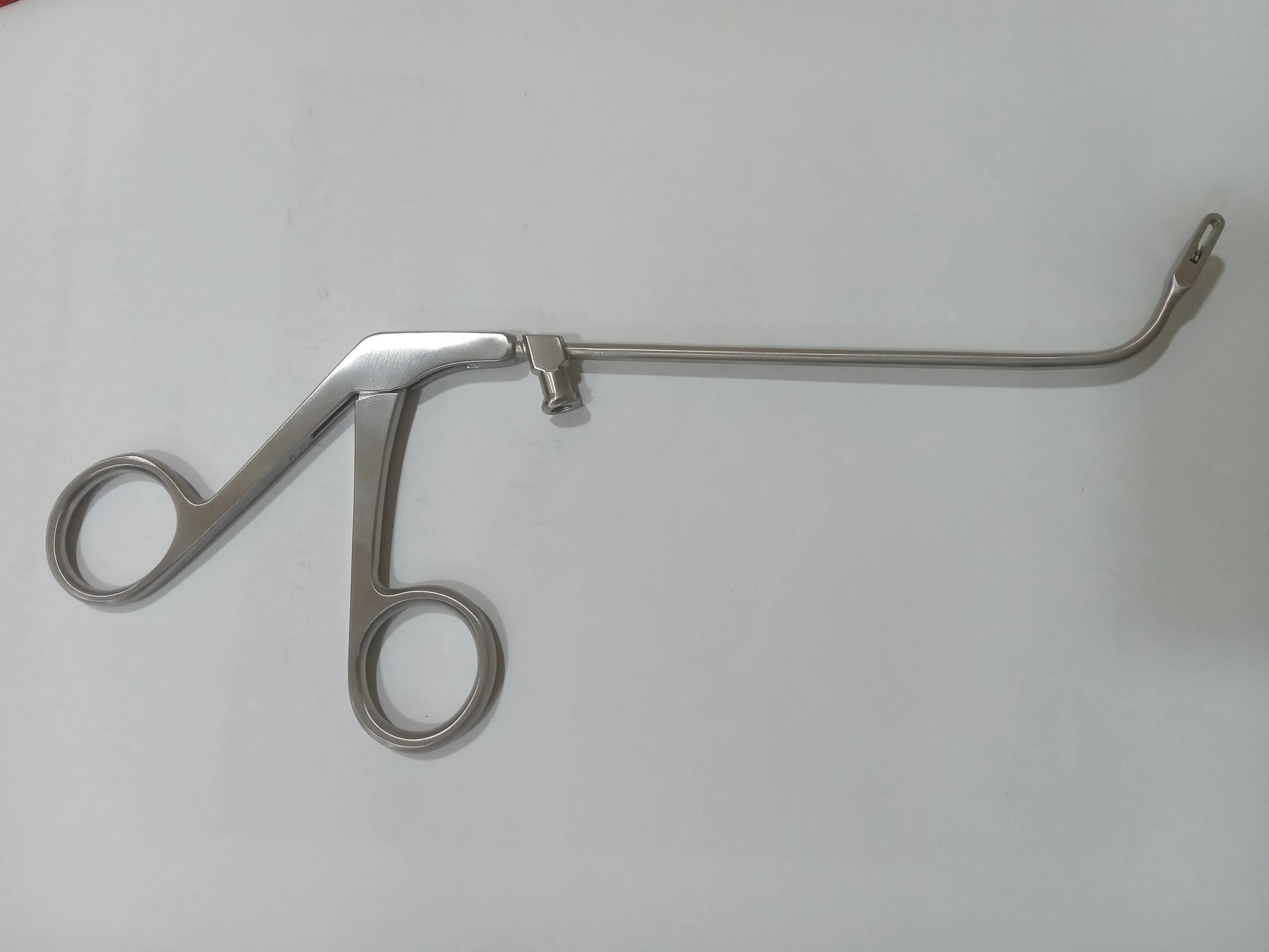 Metal ring-handle instrument with curved shaft