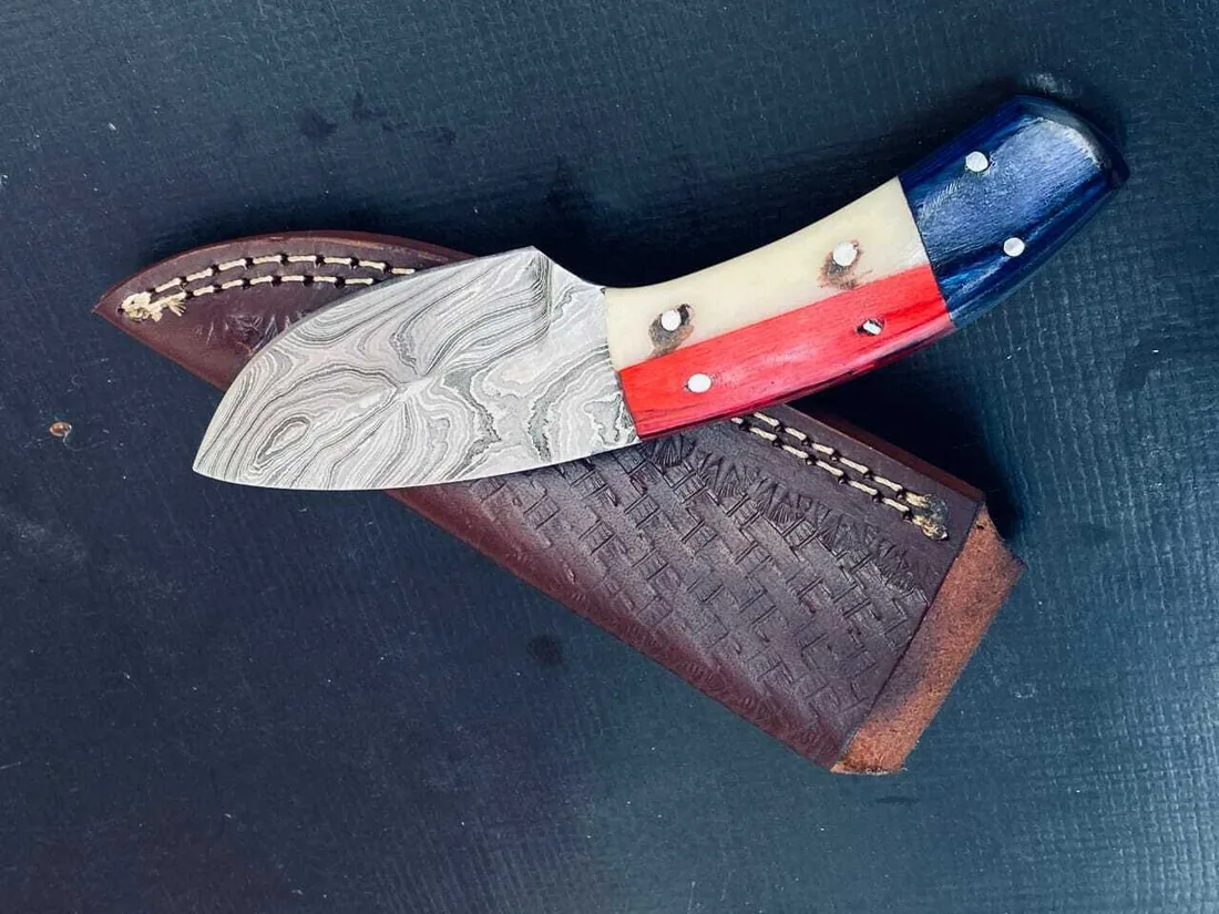Custom Damascus knife with a tooled leather sheath